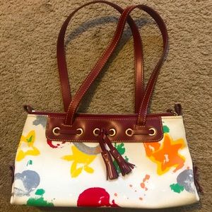 Dooney & Bourke tassel top zip purse. White main color with multicolor graffiti!